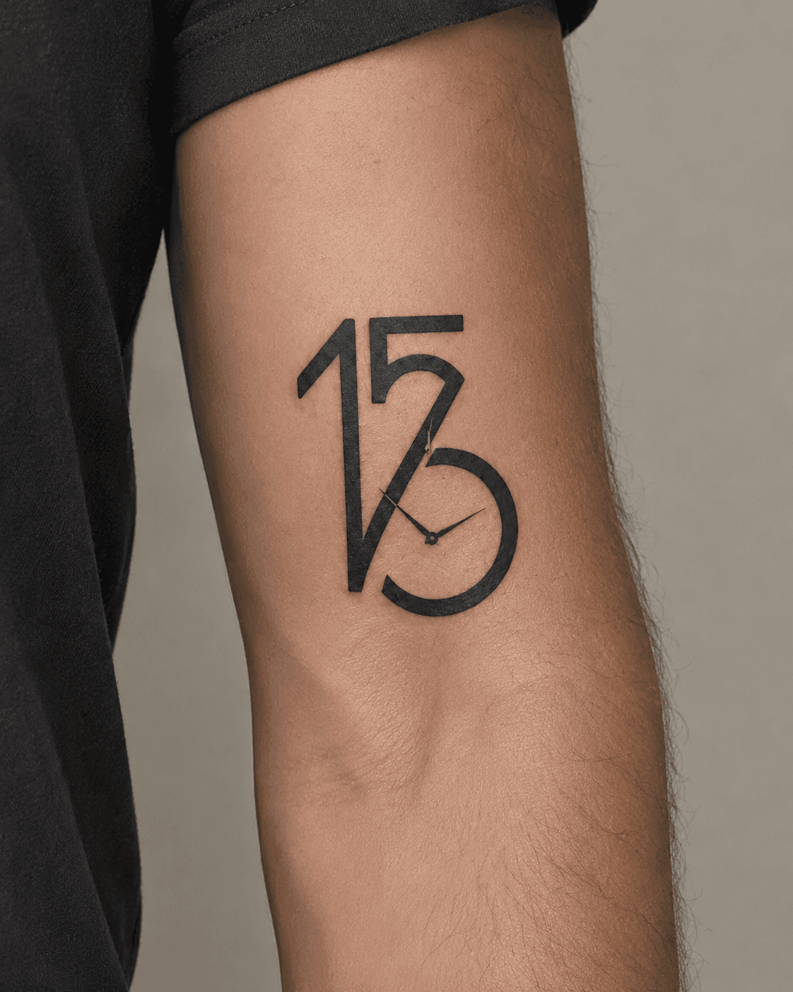 The 156 / watch monogram inked on an inner bicep.
